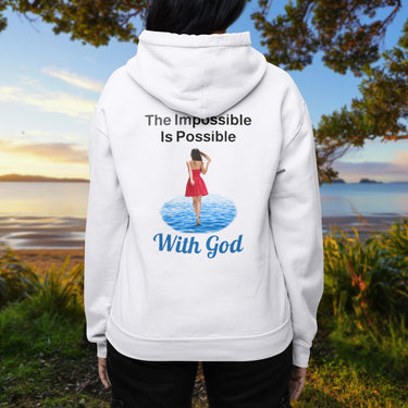 Gildan unisex zip-up hoodie with “Impossible Woman” design featuring a woman walking on water and uplifting message, Christian apparel made from soft cotton-poly fleece, ideal for cooler weather and faith-forward style, woman in white hoodie